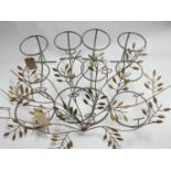 A decorative metal light sconce and 4 garden pot holders.