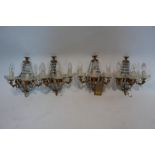 A pair of gilt metal chandeliers together with four matching wall lights