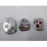 Three Israeli, sterling silver and hand-enamelled brooches of contemporary design, decorated with