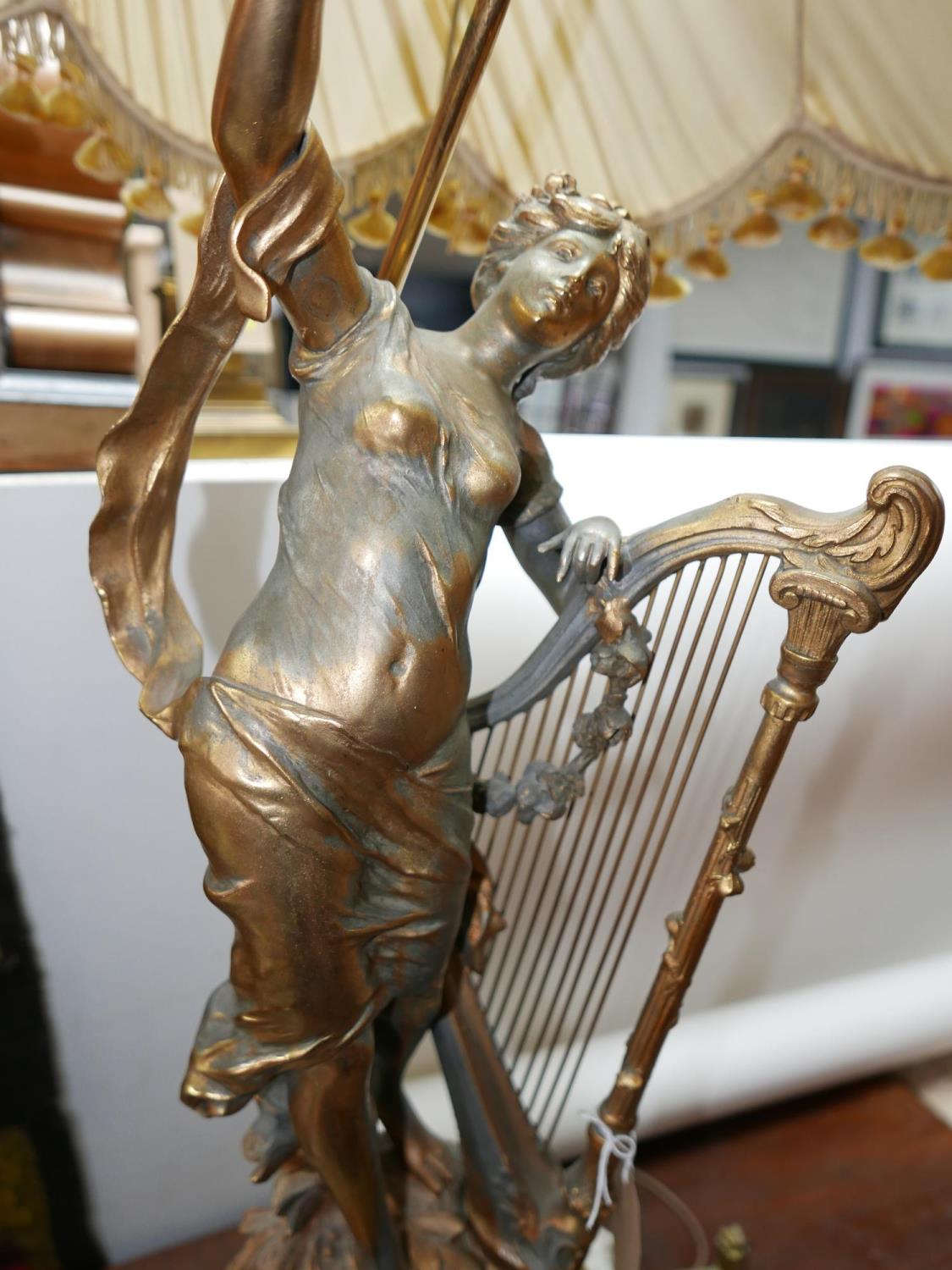 A late 19th century French style gilt spelter and onyx mantel clock with lamp held aloft (some - Image 3 of 3