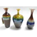 Three Persian Isfahan drip glazed vases of varying size and form, marked to bases, H.34cm tallest