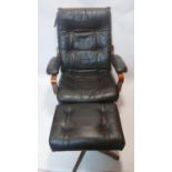 A contemporary faux leather swivel armchair and footstool