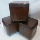 Three brown leather stools