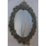 A contemporary mirror with silvered grape vine border, 95 x 66cm