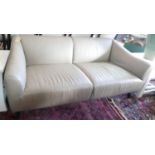 A modernist grey leather sofa. L.200cm