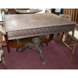 A 19th century Continental mahogany centre table with carved frieze and tripod base, H.76 W.104 D.