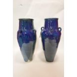 A pair of Persian blue glazed Sharab wine vessels, H.77cm (2)