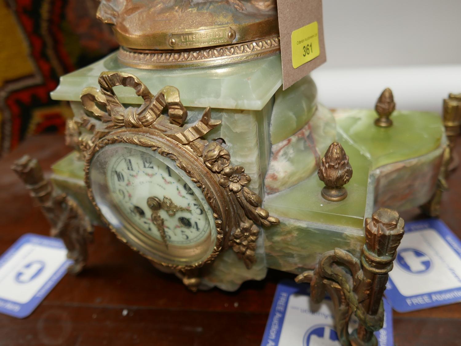 A late 19th century French style gilt spelter and onyx mantel clock with lamp held aloft (some - Image 2 of 3