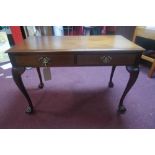 A Georgian mahogany side table with two drawers, raised on ball and claw feet, H.72 W.107 D.52cm