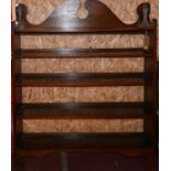 A stained oak open bookcase, with shaped gallery top, raised on bracket feet, H.150 W.122 D.25cm