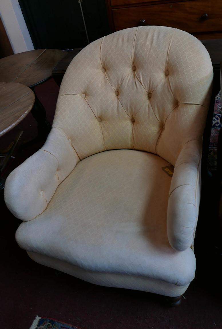 A 19th century mahogany armchair in the manner of Howard & Sons, in button backed apricot woven