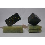 A tumbling dice on an onyx base and a matching domino. H.13cm