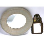 A vintage grey painted oval mirror with broad frame together with a continental mirror with urn