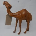 A leather model of a camel. H.33cm