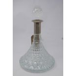 A glass ship's decanter and stopper, with silver plated collar and rim, H.23cm