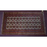 A North East Persian Turkoman rug, repeating stylised gul motifs on an ivory field complimented by a