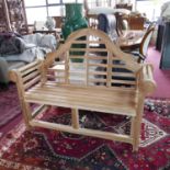 A Lutyens style teak garden bench