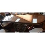 A large Italian very well inlaid walnut dining table on swept twin supports. L.260 W.110cm