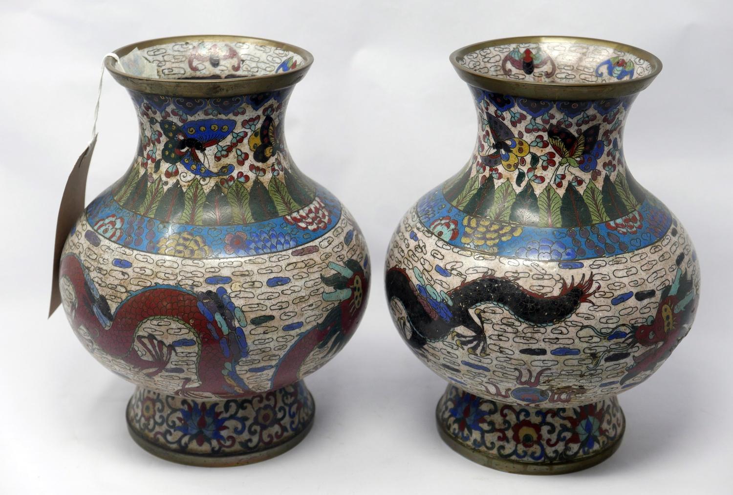 A pair of 19th century Chinese brass cloisonne vases, decorated with dragons chasing flaming
