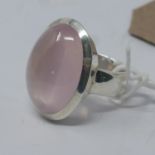 A large, sterling silver and rose quartz cabochon ring, 18.5 g.