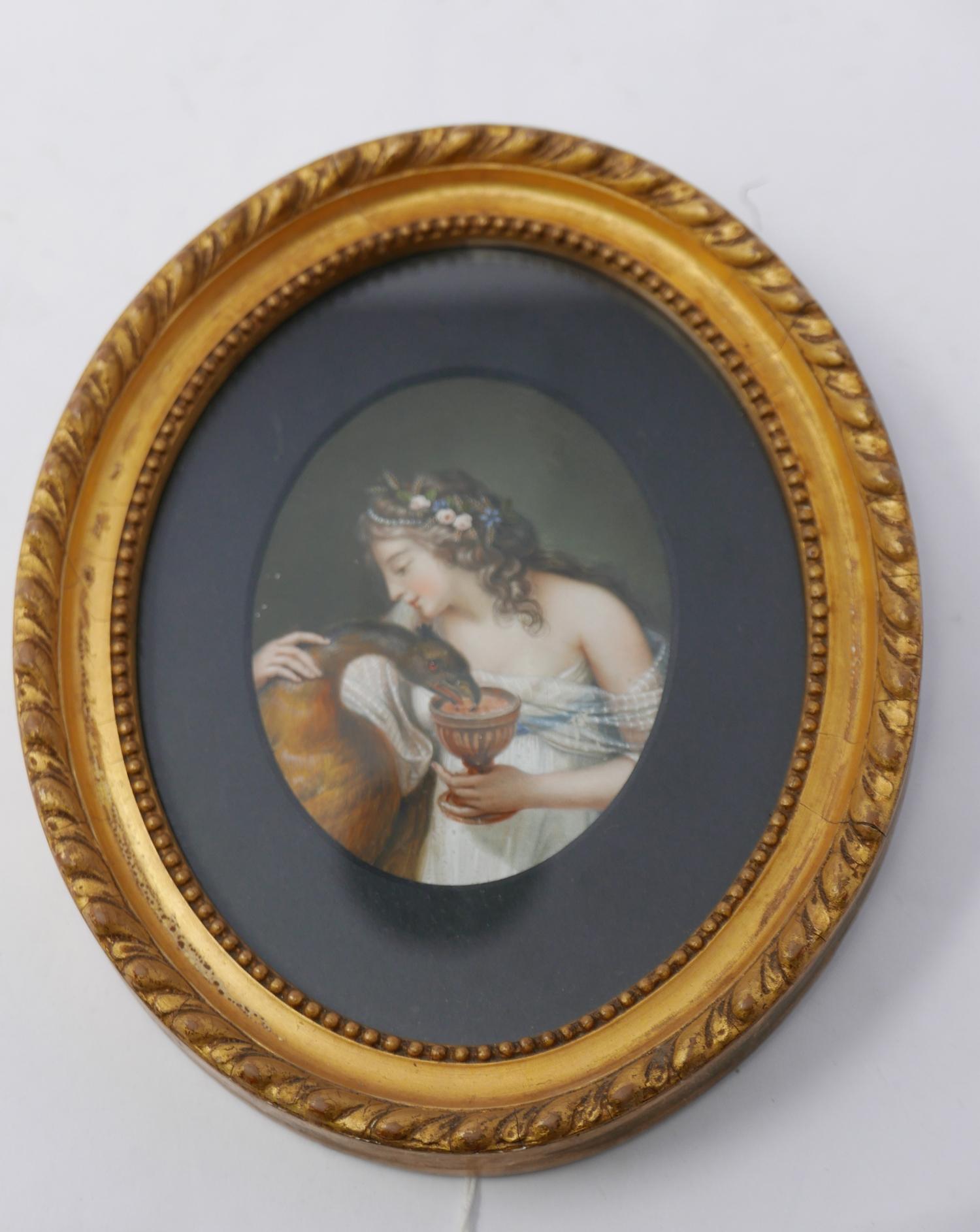 A 19th century finely painted oval miniature, depicting a maiden feeding a phoenix from a goblet, 10