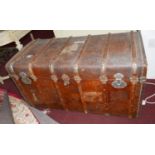 An early 20th century, large, Greek, leather-bound, wooden trunk with exterior wooden strip