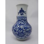 A 19th century Chinese blue & white porcelain vase with floral decoration, small chip to rim and