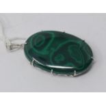 A sterling silver and large malachite cabochon pendant to a sterling silver pendant loop, 6.2 x 3.