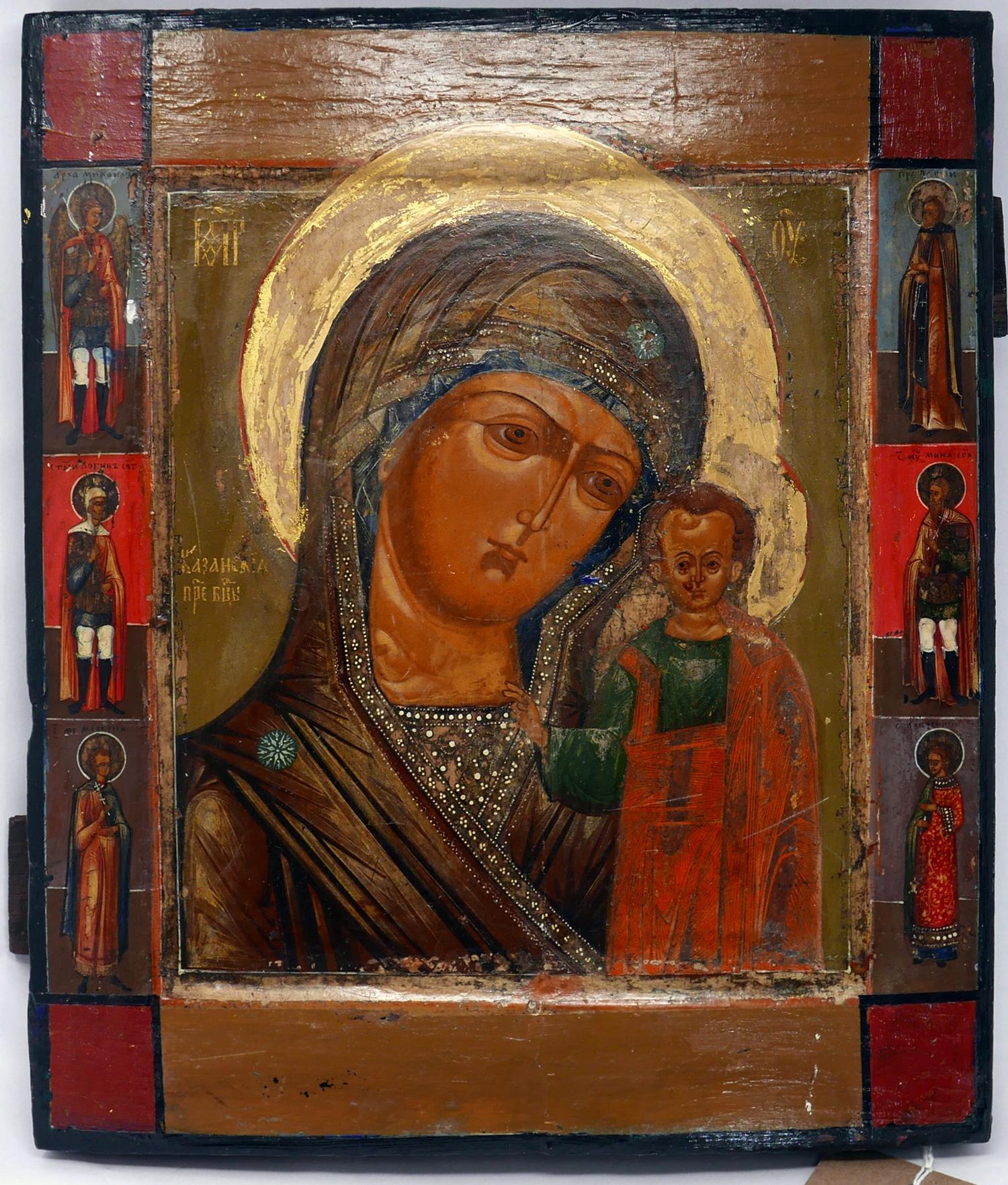 A Russian icon of the Mother of God of Kazan with selected saints to border, tempera on wood