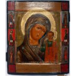 A Russian icon of the Mother of God of Kazan with selected saints to border, tempera on wood