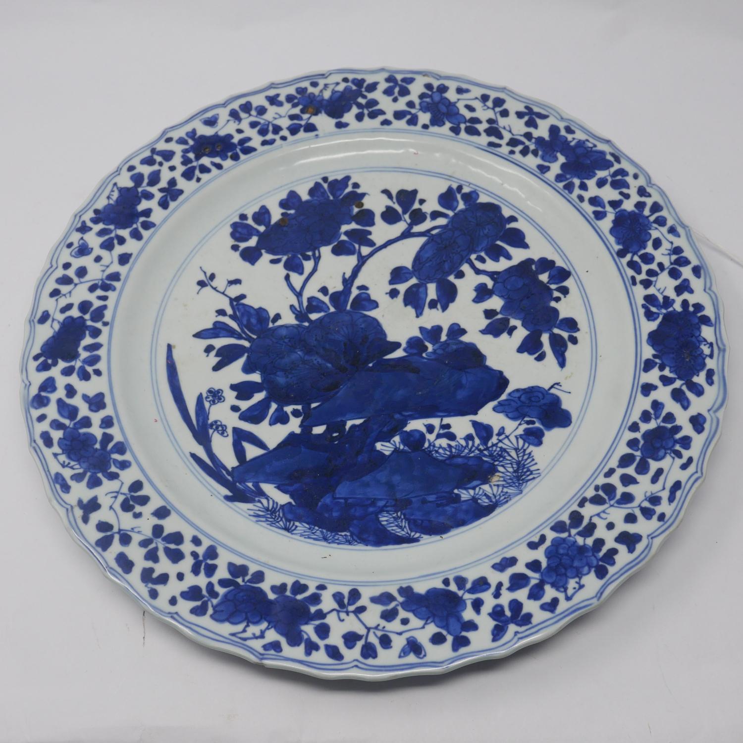 A 19th century Chinese blue & white porcelain charger, with floral decoration and six character