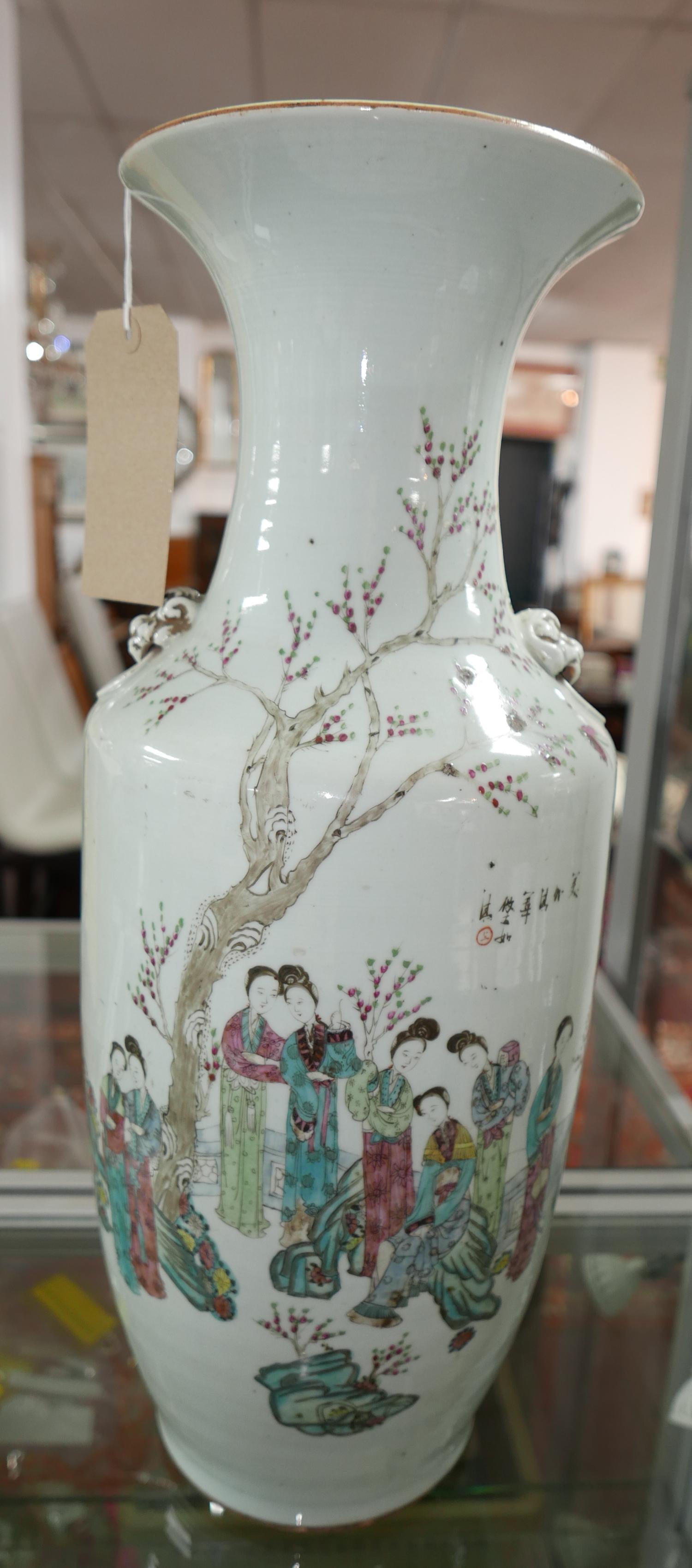 A large 19th century Chinese famille rose porcelain vase, decorated with figures in a courtyard