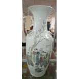 A large 19th century Chinese famille rose porcelain vase, decorated with figures in a courtyard