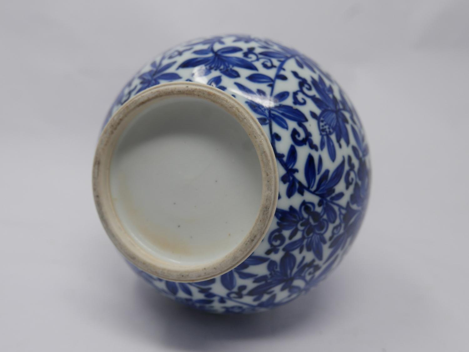 A 19th century Chinese blue & white porcelain vase with floral decoration, small chip to rim and - Image 2 of 3