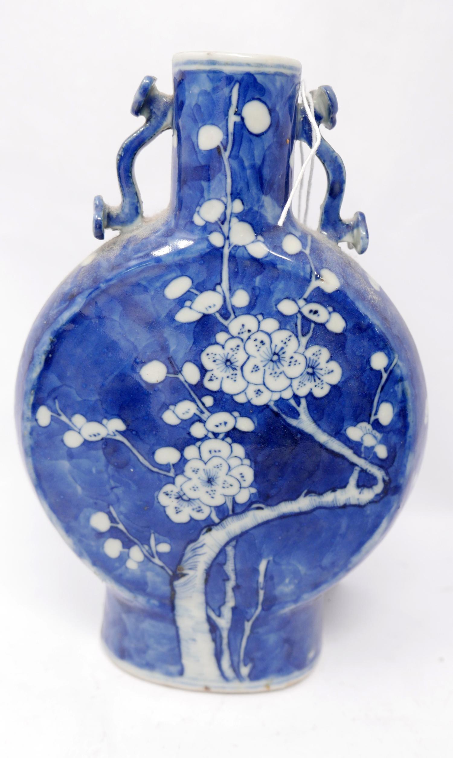 A 19th century Chinese blue & white porcelain moon flask vase, with prunus design and four character