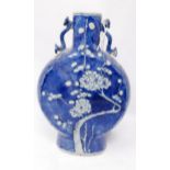 A 19th century Chinese blue & white porcelain moon flask vase, with prunus design and four character