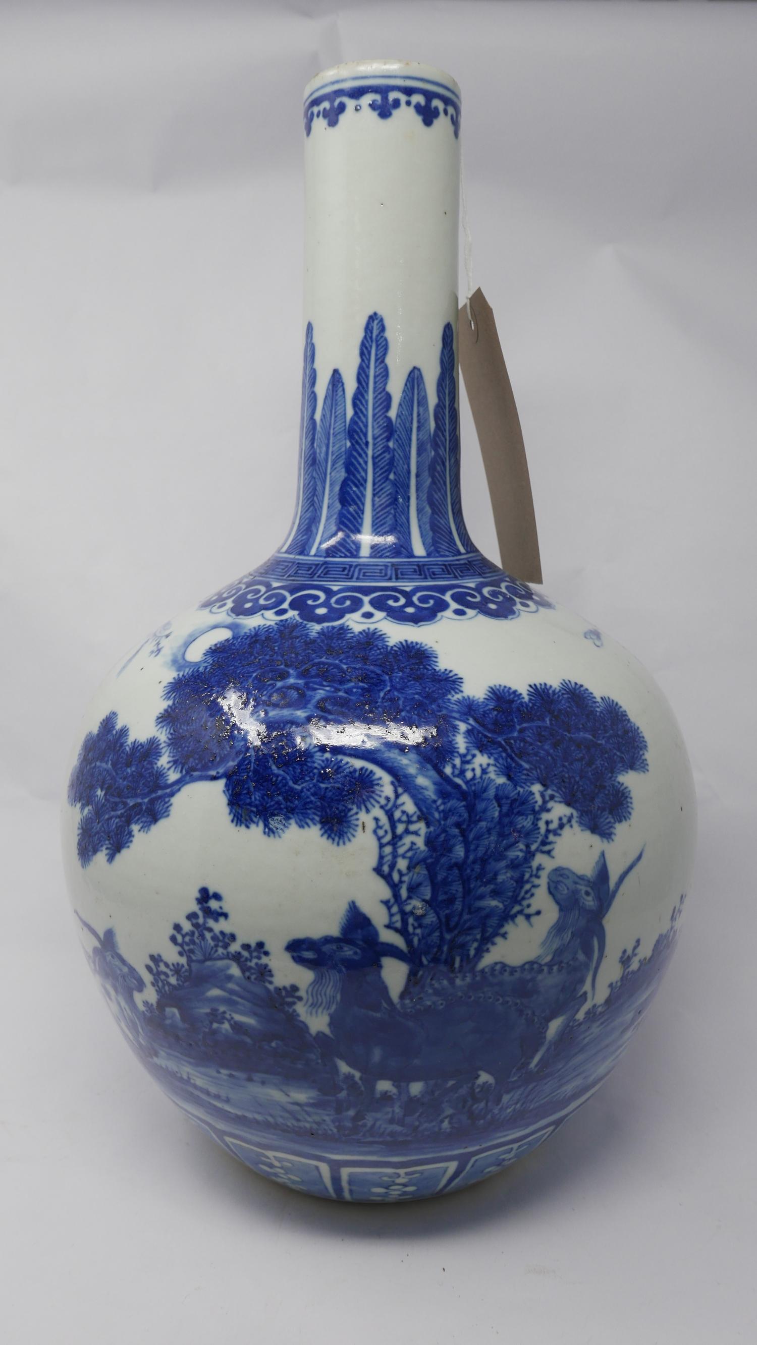 A 19th century Chinese blue & white porcelain vase, decorated with birds & goats amongst foliage,