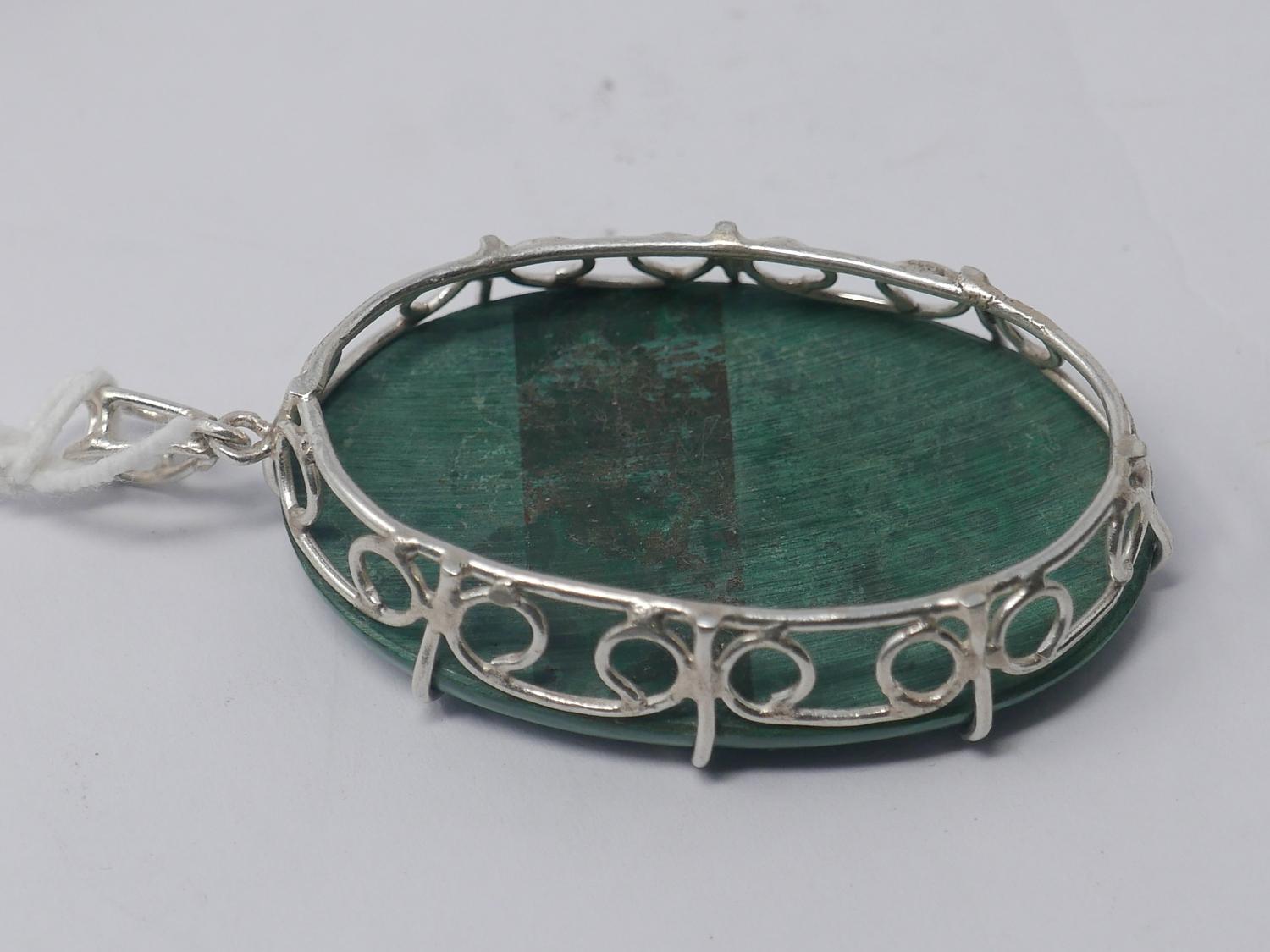 A sterling silver and large malachite cabochon pendant to a sterling silver pendant loop, 6.2 x 3. - Image 2 of 2