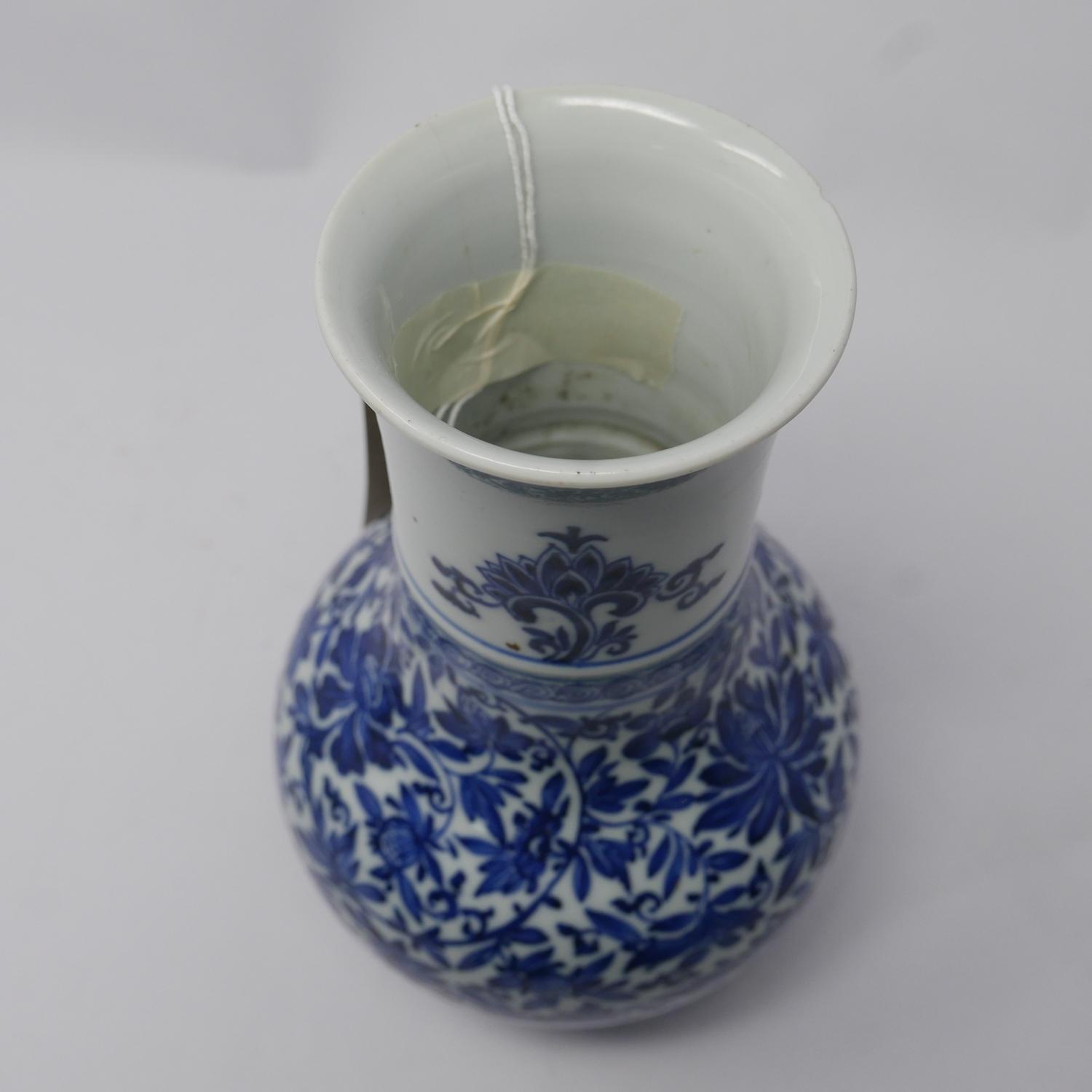 A 19th century Chinese blue & white porcelain vase with floral decoration, small chip to rim and - Image 3 of 3