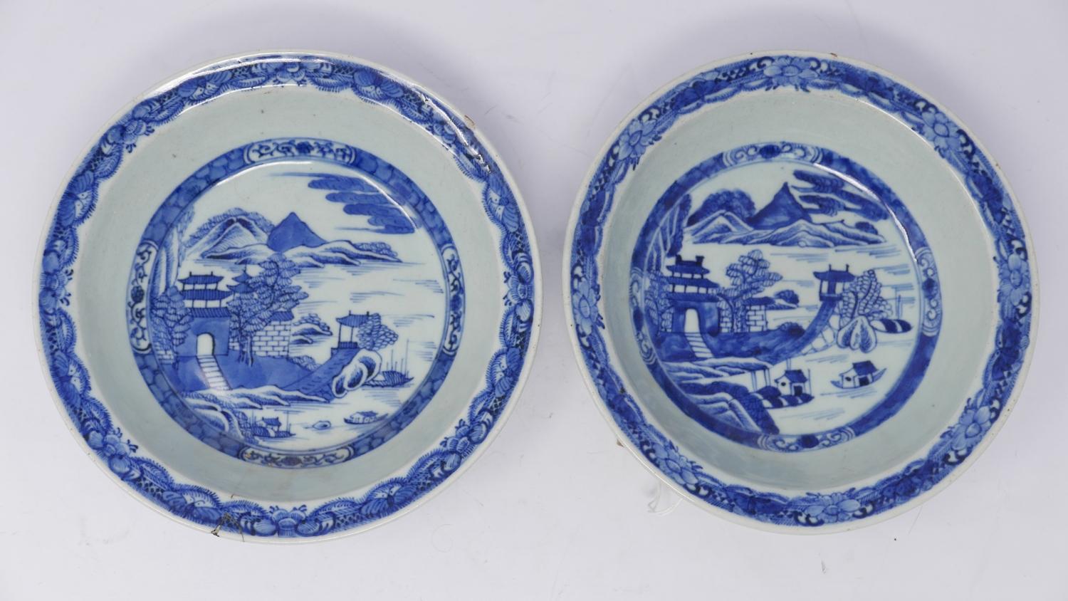 A pair of 19th century Chinese blue & white porcelain bowls, with willow pattern, one repaired