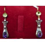 A boxed pair of silver and yellow gold earrings set with a faceted, round peridot, diamond, pearl