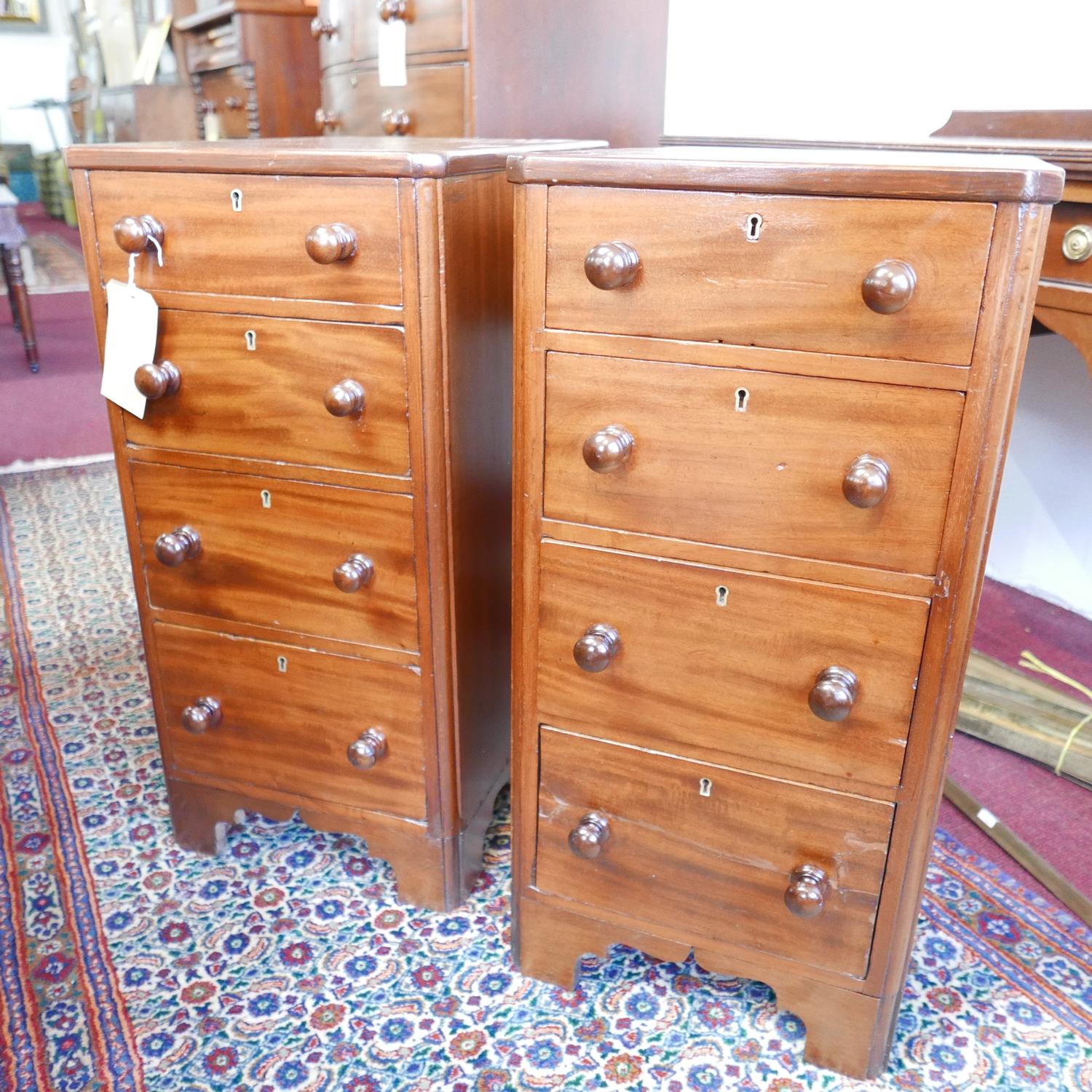 A pair of early Victorian mahogany pedestal chest, with four graduating drawers, raised on bracket