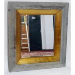 A contemporary mirror with bevelled plate, 94 x 84cm