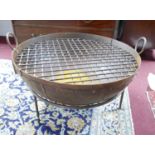 A metal fire pit, H.42 Diameter.60cm