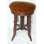 An Edwardian mahogany adjustable piano stool