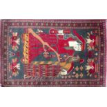 A 20th century Persian pictorial rug, lady with bird, geometric border, 155 x 99cm