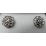 A pair of platinum and 18ct white gold diamond cluster stud earrings (approx 2 carats total), each