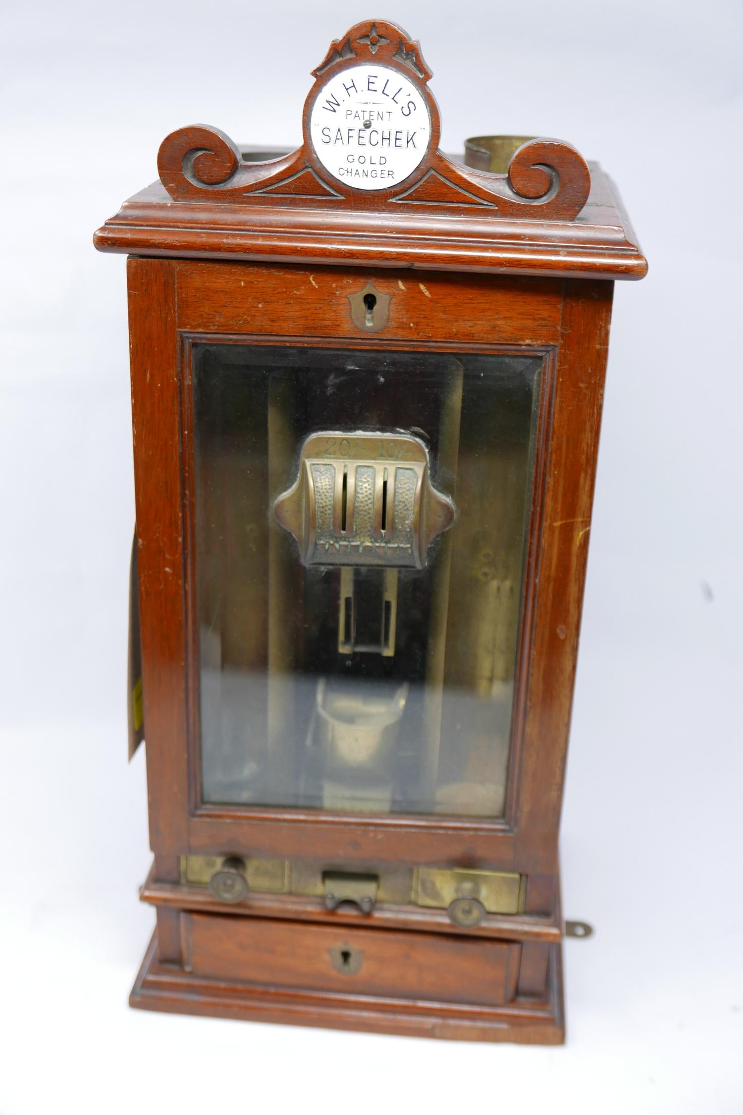 W.H.Ell's Safechek Gold Changer machine, H.47cm