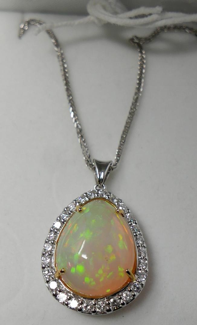 A boxed, 18ct white gold, diamond and pear-shaped opal pendant on an 18ct white gold chain, Pendant: - Image 3 of 3