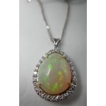 A boxed, 18ct white gold, diamond and pear-shaped opal pendant on an 18ct white gold chain, Pendant: